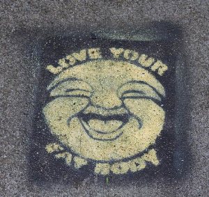 Image of street art reading "Love your fat body"