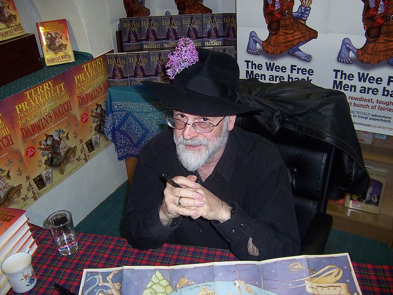 Photograph of author Terry Pratchett at a book signing, courtesy of Myrmi via Wikimedia Commons